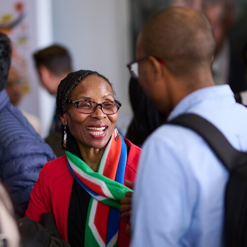 An attendee can be seen networking during an event.