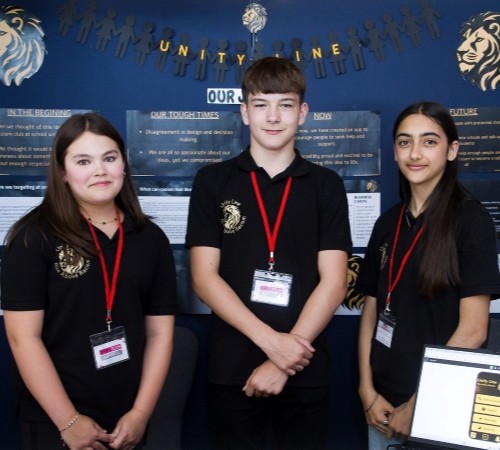 Three finalists at the TeenTech Awards showing their project Unity Line designed to provide support to those who’ve experienced racism