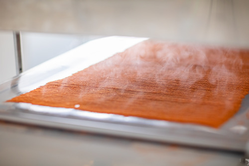Photo of Grinsup being developed, with steam leaving the product.