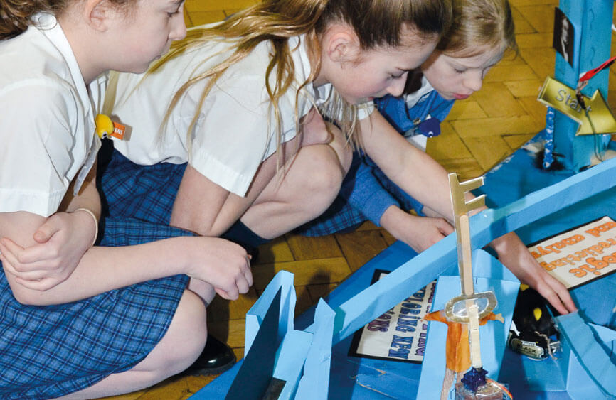 A group of children working on a design project.