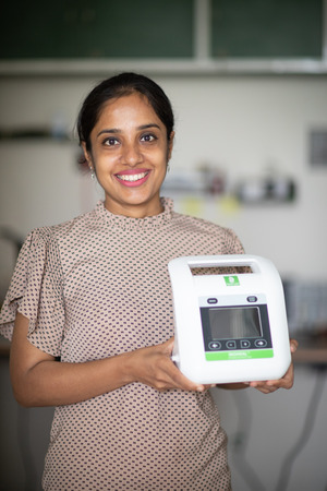 Photo of Shivani holding InoHeal.