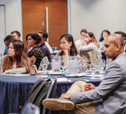 Participants listening to session chair presentations