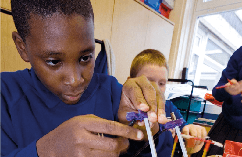 A group of children working on a design project.