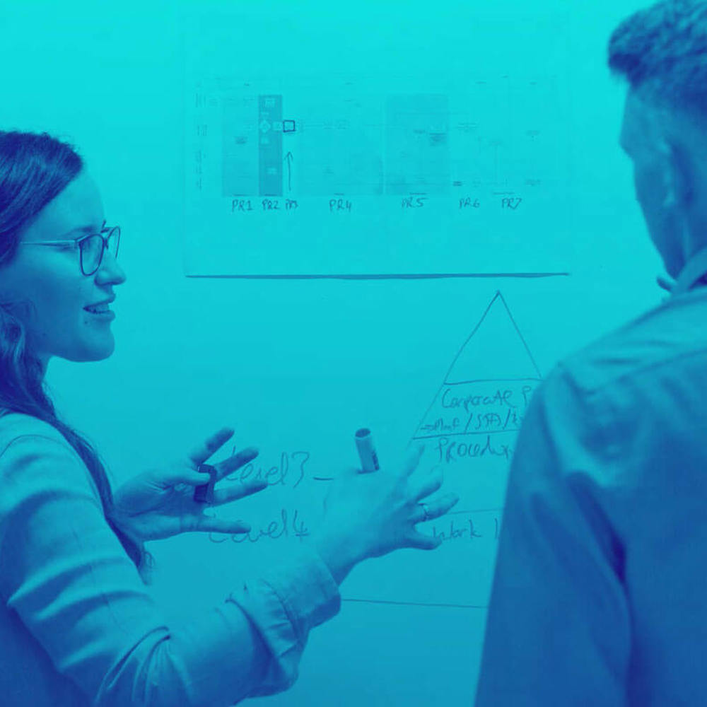 Two Engineers With Whiteboard Blue Duo