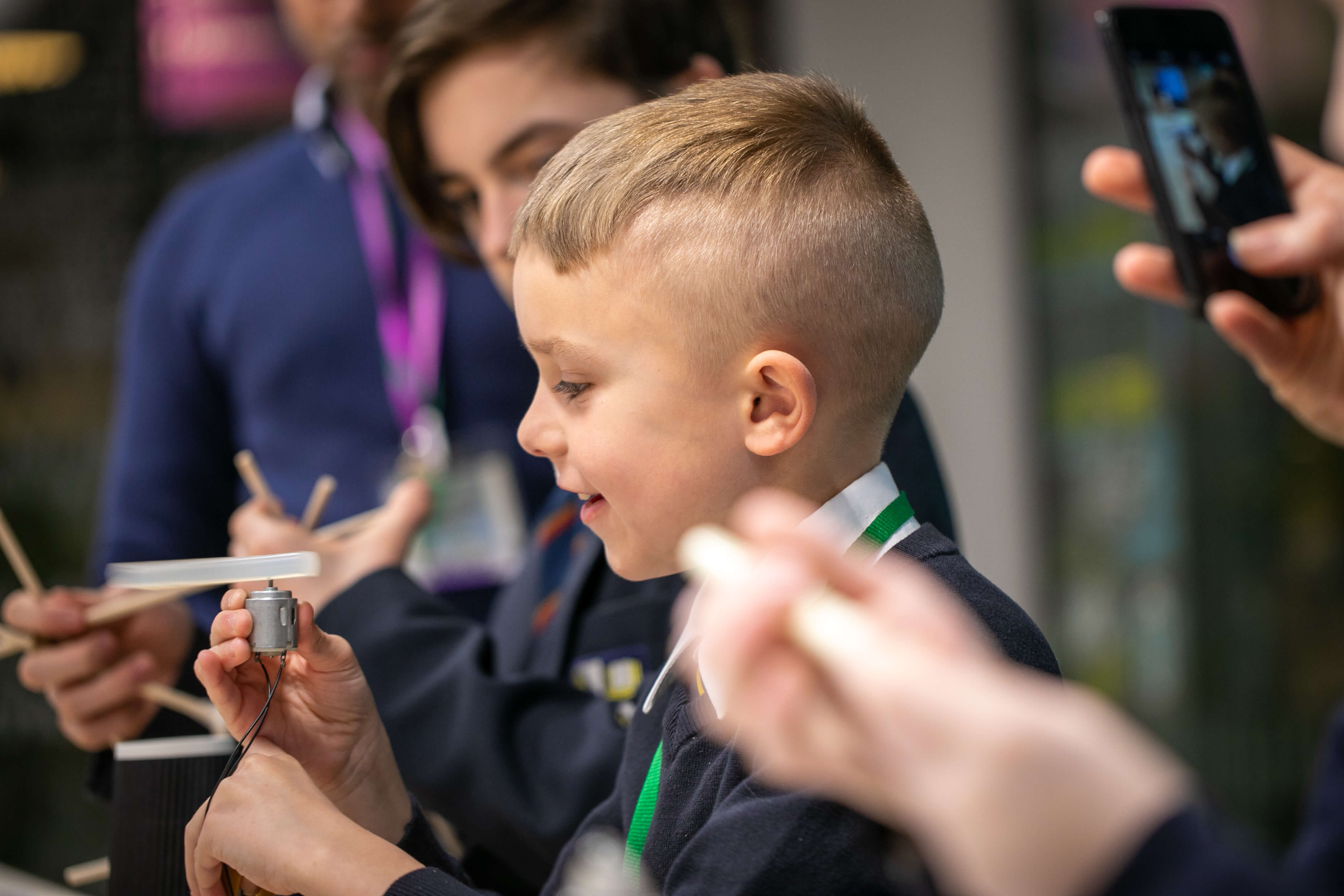A child holding a motor device.