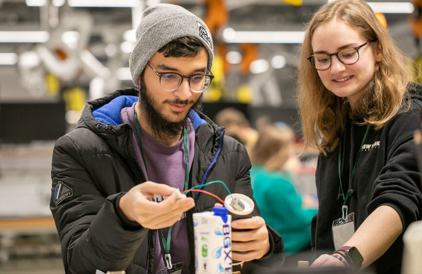 Two people working on an engineering project.