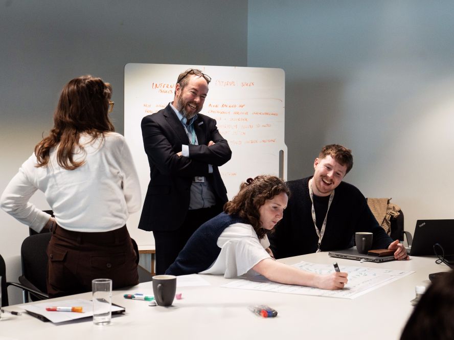 Participants collaborating during a systems thinking workshop
