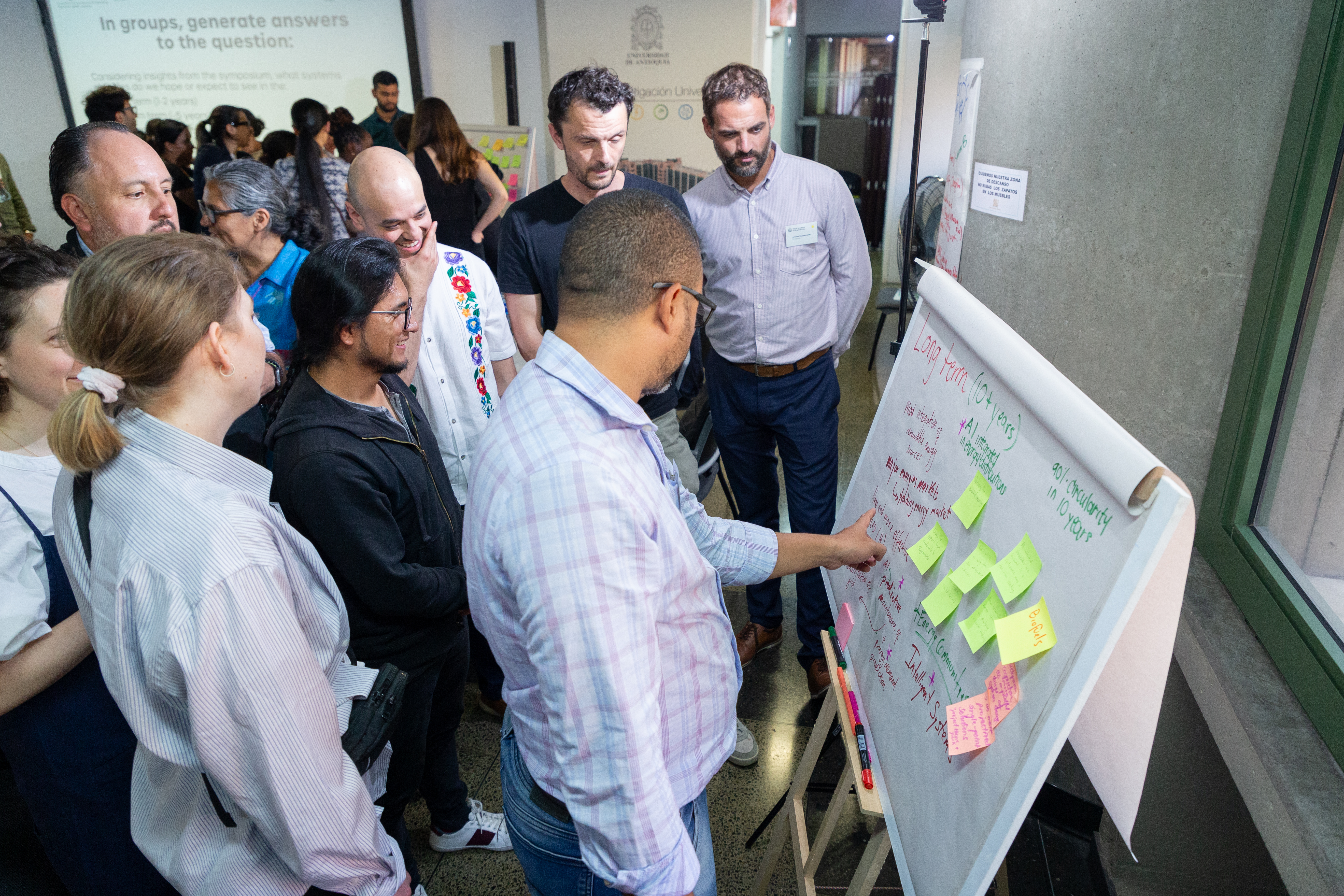 Participants collaborating in a group activity during the symposium